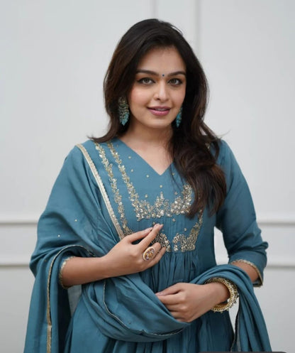 Beautiful Muslin Silk Anarkali Duppata Suit In Teal Colour.